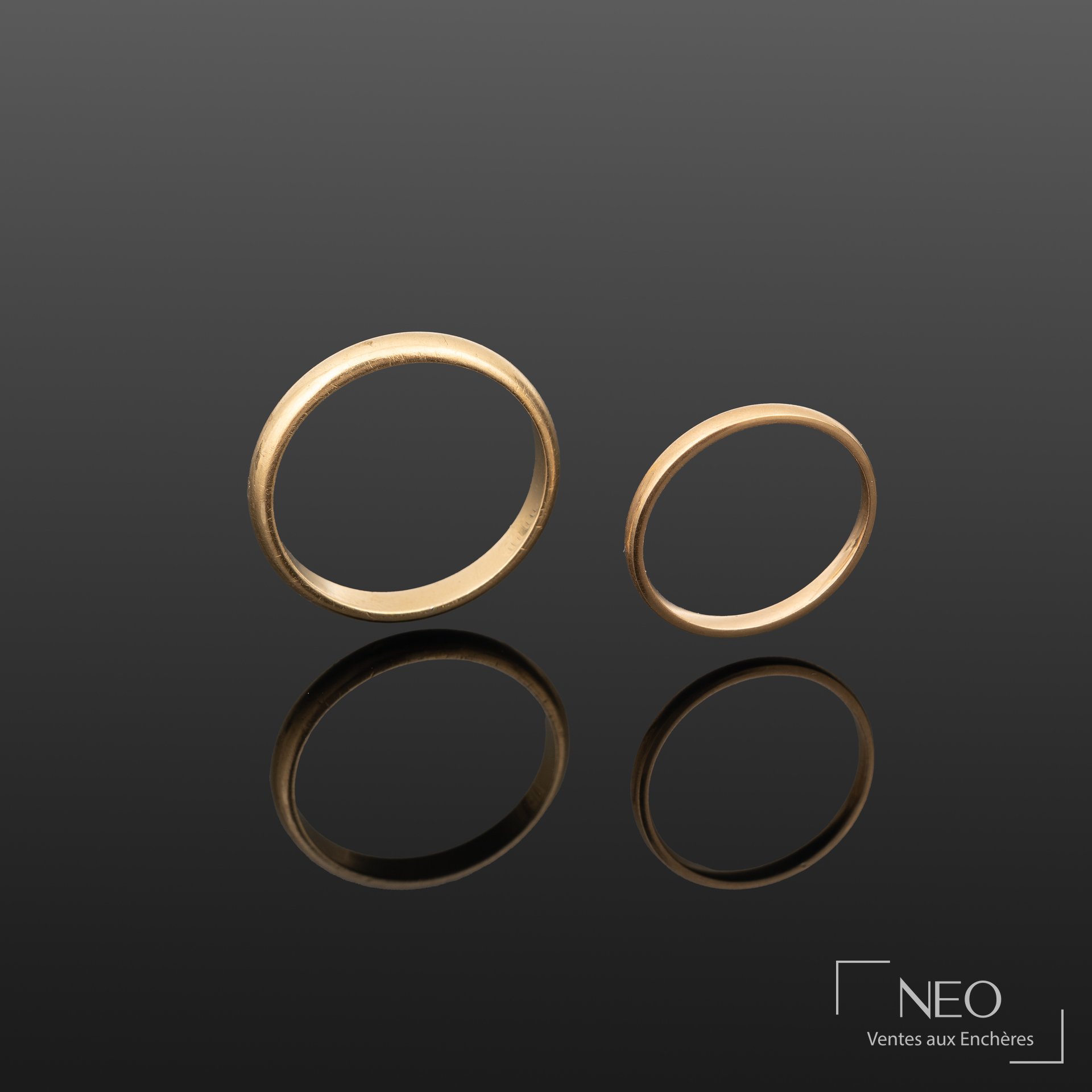 Ensemble de deux alliances en or jaune 18K 750/1000