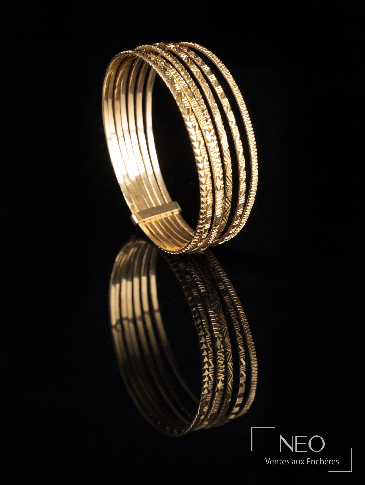 Bracelet semainier en or jaune 18 carats à motifs géométriques