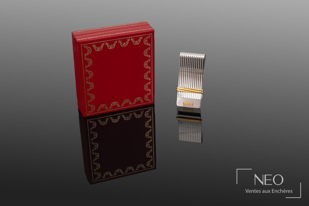 Pince à billets Cartier Must de Cartier dans son écrin rouge