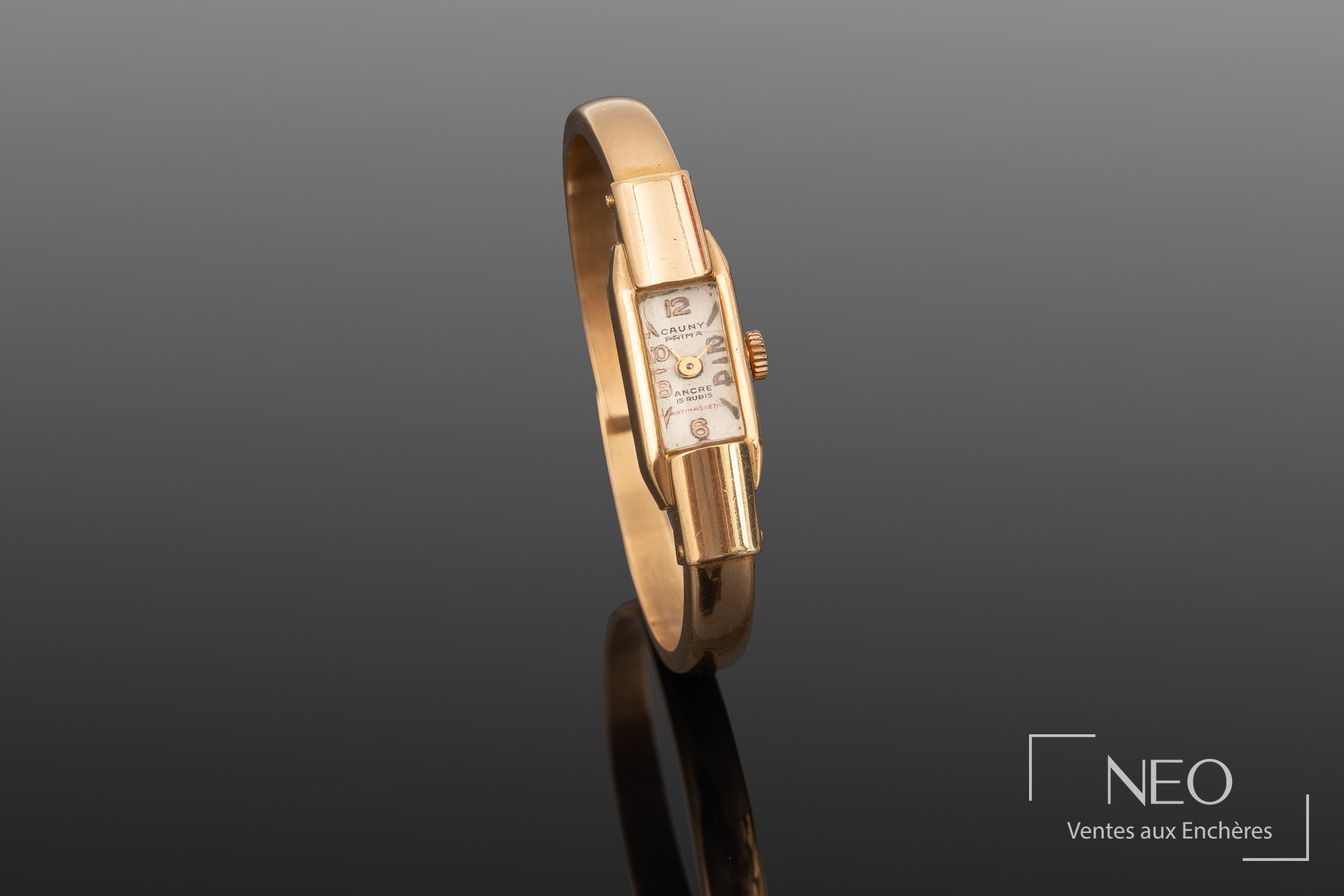 CAUNY Prima, montre-bracelet jonc ouvrant en or jaune 18 carats