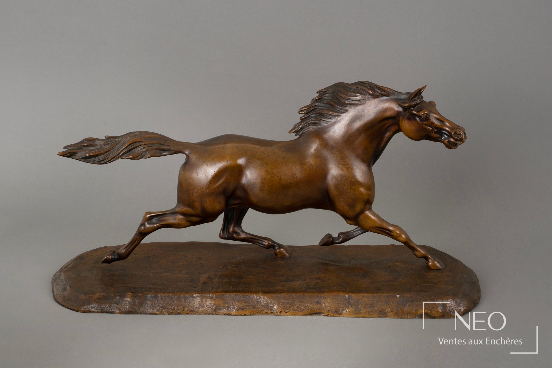 D’après Jules Moigniez, Cheval en course, bronze à patine brune nuancée