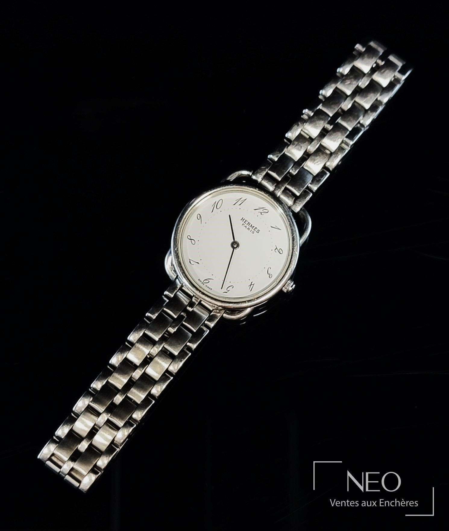 HERMÈS montre bracelet Arceau en acier, cadran émaillé blanc, mouvement quartz