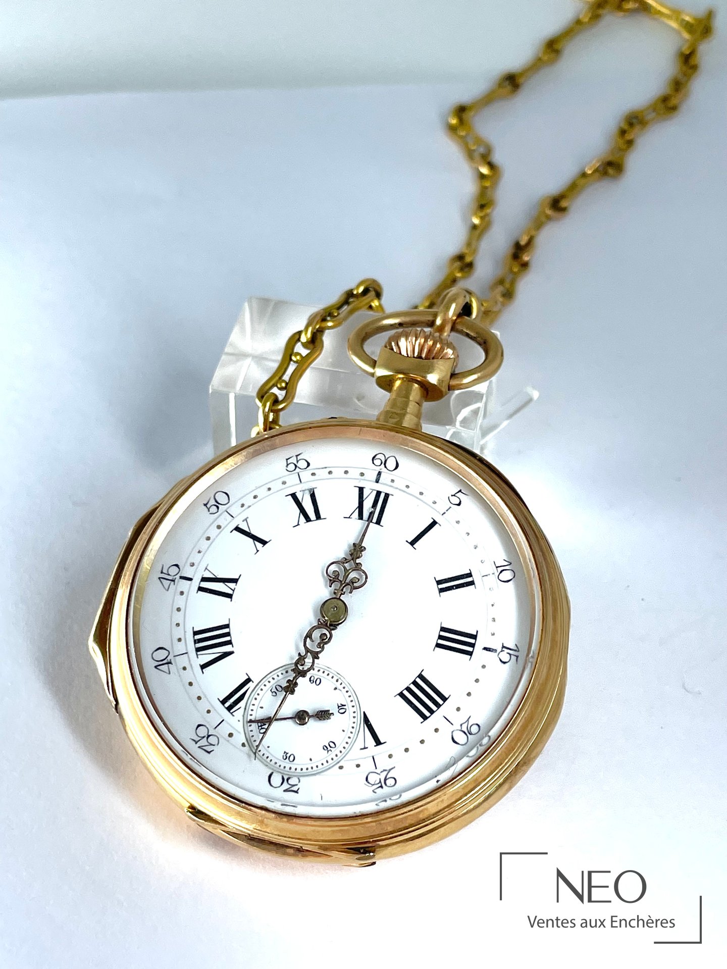 Montre à gousset et chaîne maille en or jaune 18 carats