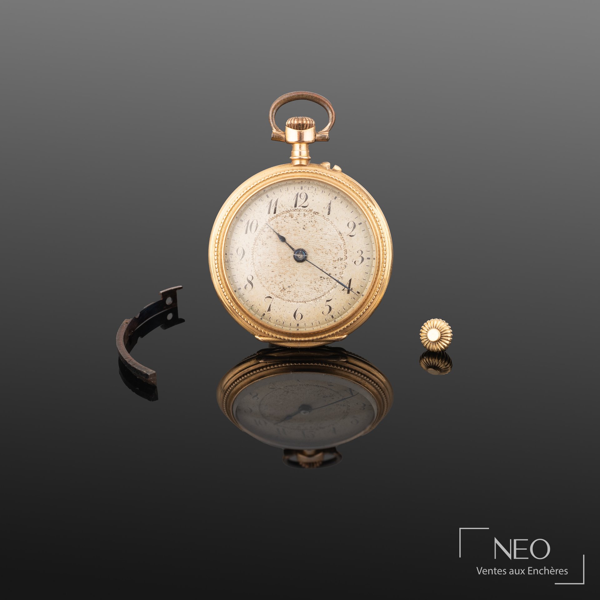Montre à gousset en or jaune avec cadran gris à chiffres arabes