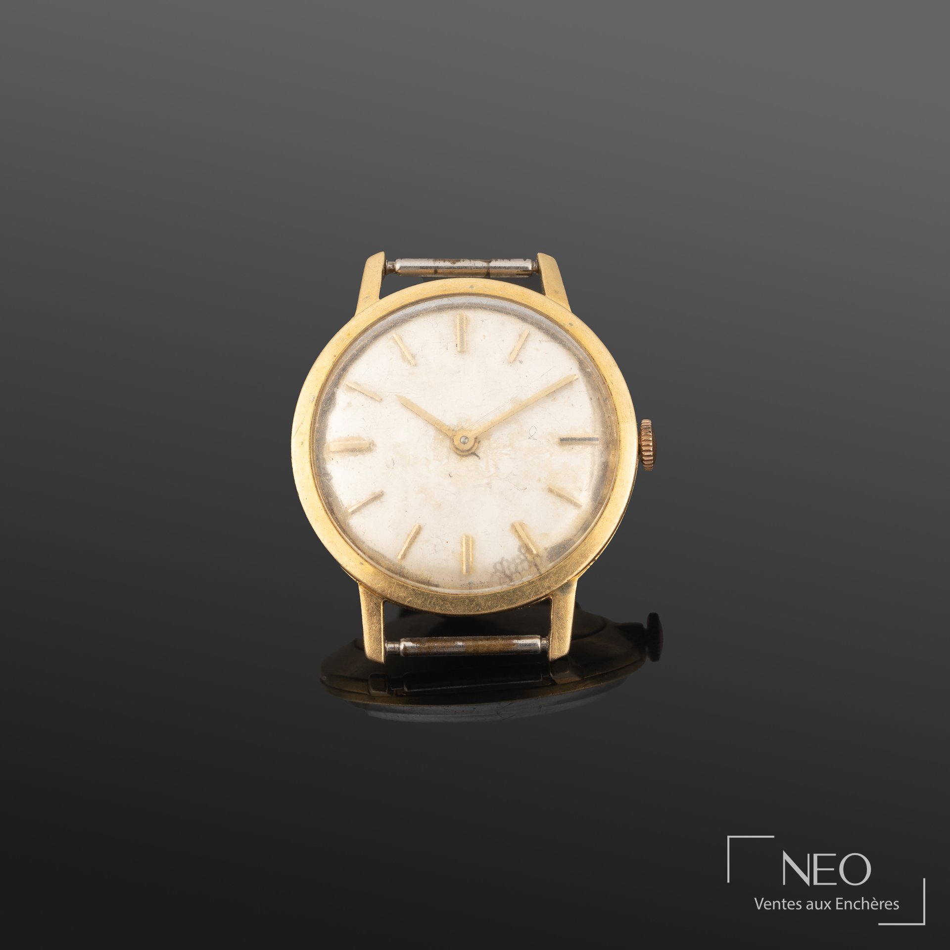 Montre bracelet en or jaune 18K, cadran rond et mouvement mécanique