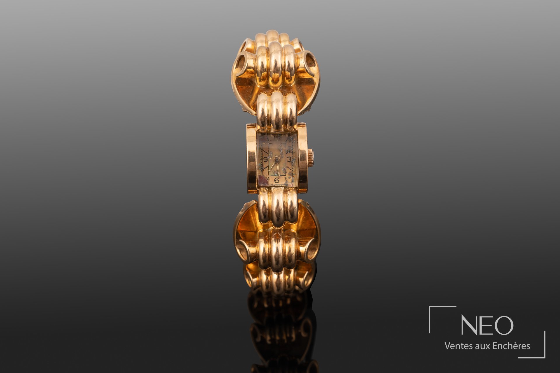 Montre bracelet tank en or jaune 18 carats, mouvement mécanique