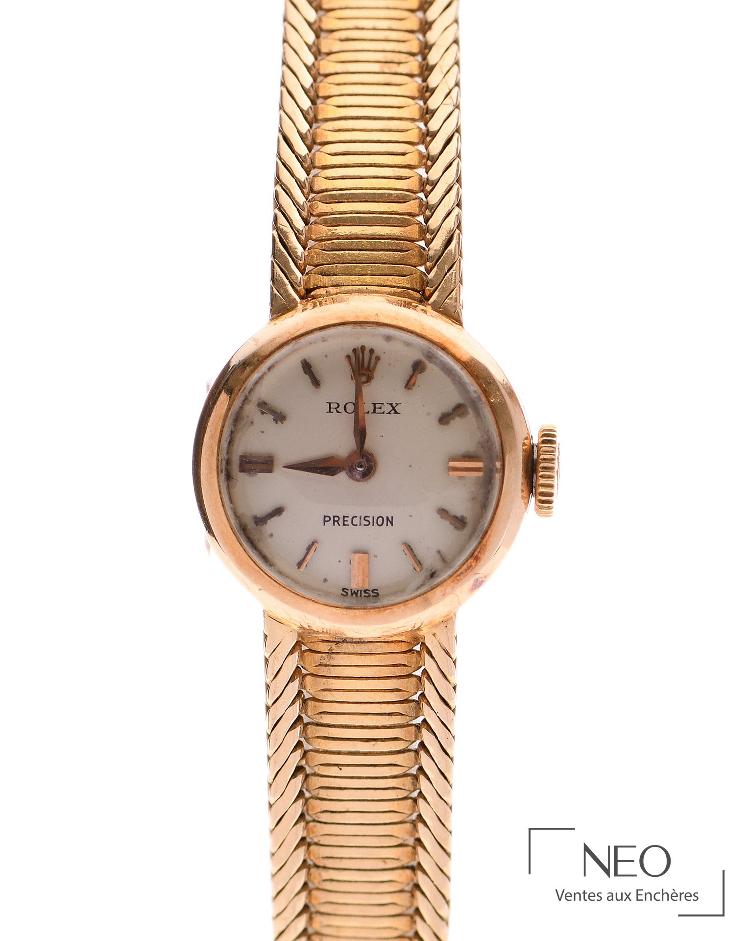 Montre-bracelet Rolex en or jaune avec cadran crème signé et bracelet à mailles serpent.